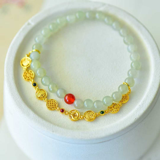 Close-up of Hetian Qingshui jade beads with eight treasures charm