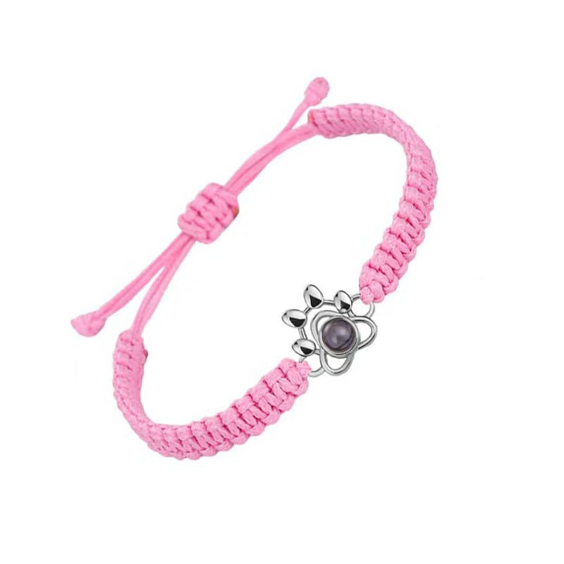 Pulsera tejida con proyección de fotos de pata de perro
