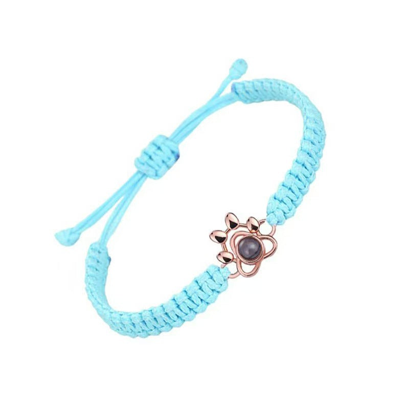 Pulsera tejida con proyección de fotos de pata de perro