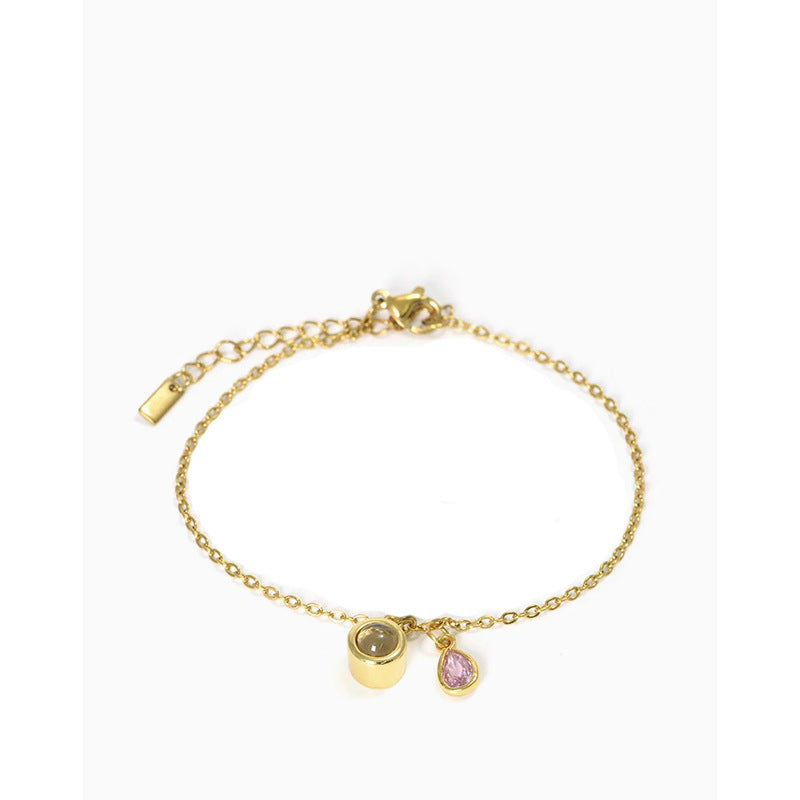 Pulsera con piedra del zodiaco en forma de gota de agua con proyección fotográfica