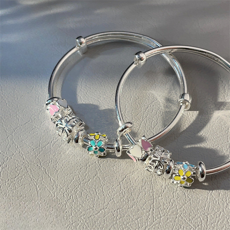 China A pair of sterling silver heart circle bracelets for children