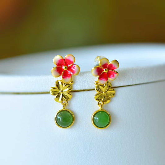 Close-up view of premium Hetian jade cabochon with colorful plum blossom earrings in S925 silver