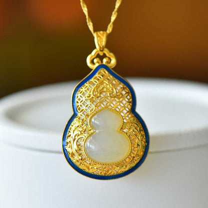 Close-up of double gourd carving on Hetian jade pendant - traditional symbol
