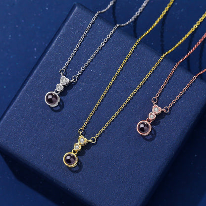 Collar con proyección de fotos y circonitas en forma de corazón 