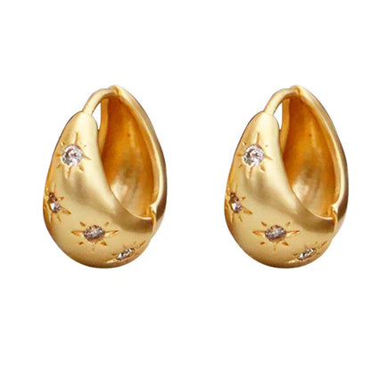 Pendientes de circonita con forma de estrella de ocho puntas estilo retro de moda.