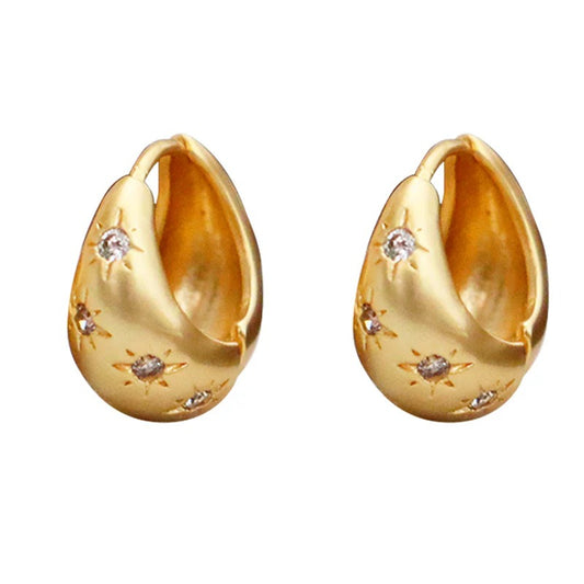 Pendientes de circonita con forma de estrella de ocho puntas estilo retro de moda.