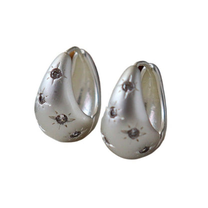 Pendientes de circonita con forma de estrella de ocho puntas estilo retro de moda.