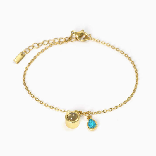Pulsera con piedra del zodiaco en forma de gota de agua con proyección fotográfica 