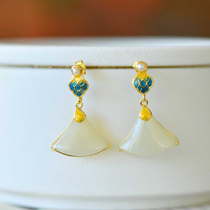 Close-up of dragon scale pattern on Hetian jade earrings - traditional design