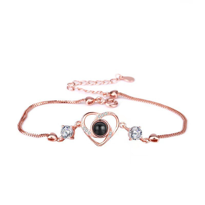 Pulsera con proyección de fotos de circonitas en forma de corazón 