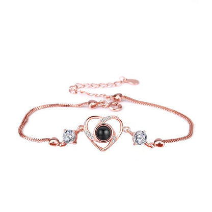Pulsera con proyección de fotos de circonitas en forma de corazón 