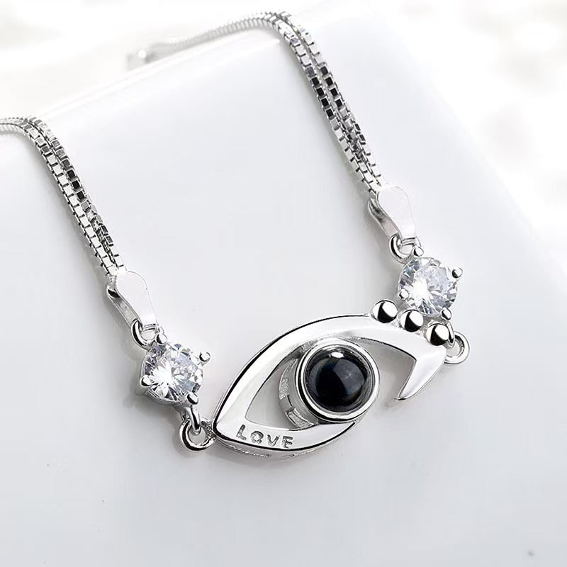 Pulsera de ojo de demonio con proyección de fotos 