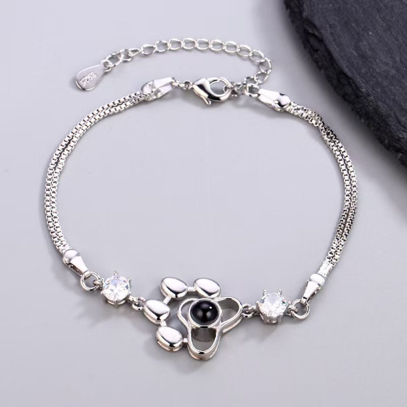 Pulsera con foto y proyección de huellas de perro 