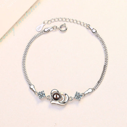 Pulsera con proyección de fotos y forma de corazón de circonitas 