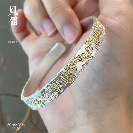 سوار فضي مطروق على شكل ريشة طائر الفينيق مطلي بالذهب 