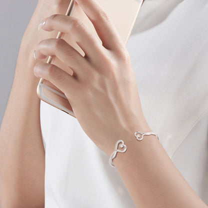 Corrosion engraved heart shape bracelet