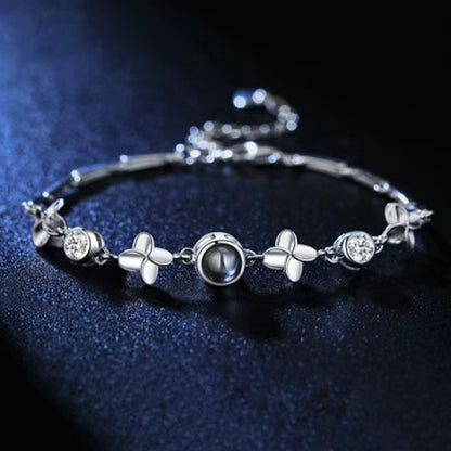 Pulsera de trébol de cuatro hojas con proyección de fotos 