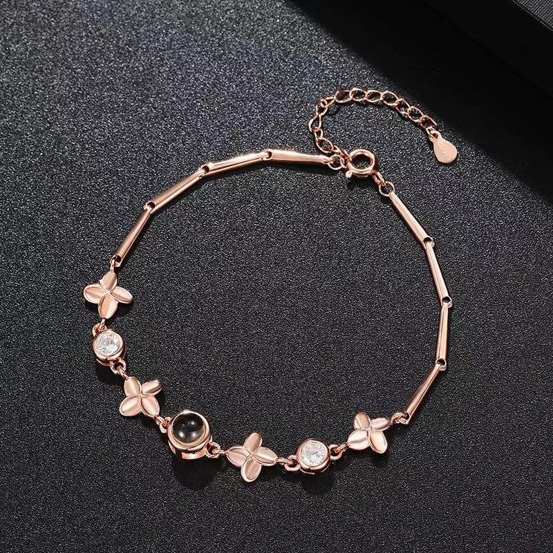Pulsera de trébol de cuatro hojas con proyección de fotos 