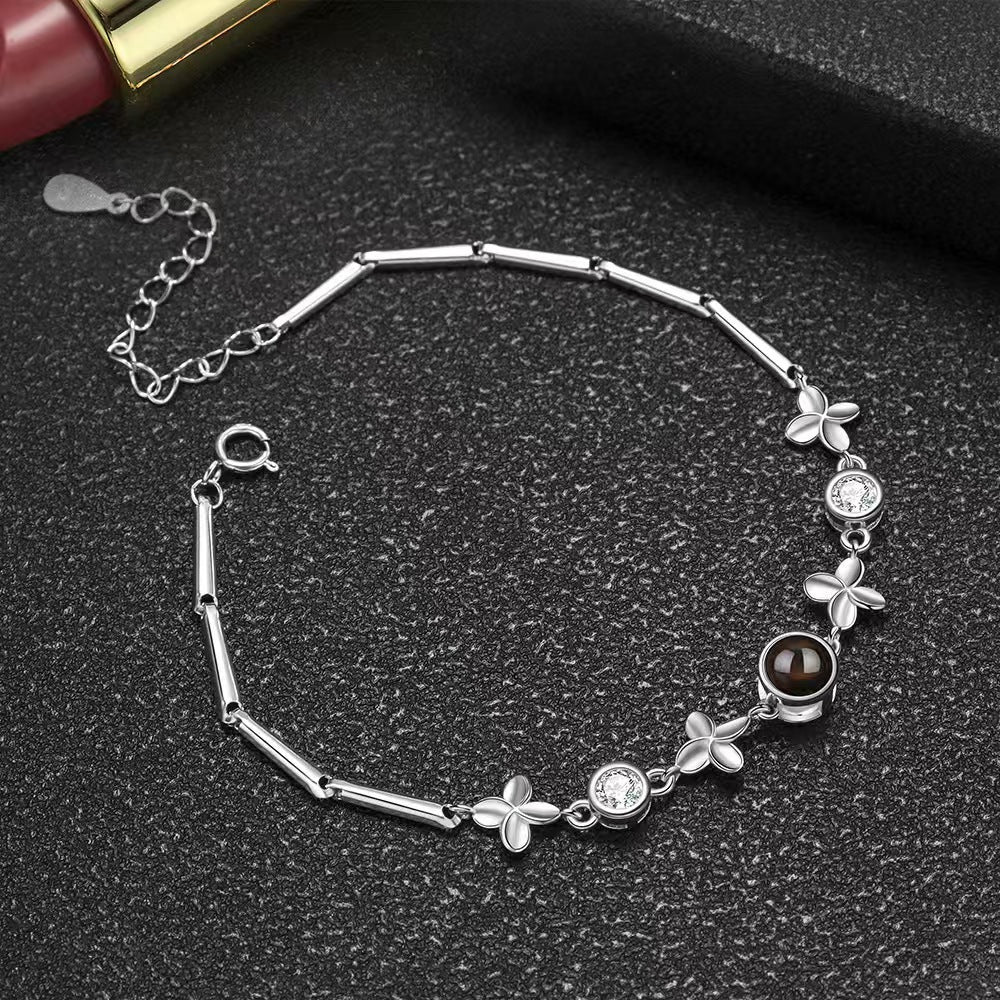Pulsera de trébol de cuatro hojas con proyección de fotos 