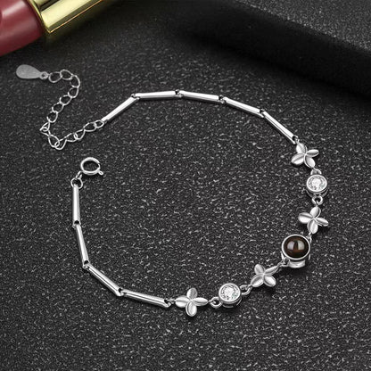 Pulsera de trébol de cuatro hojas con proyección de fotos 