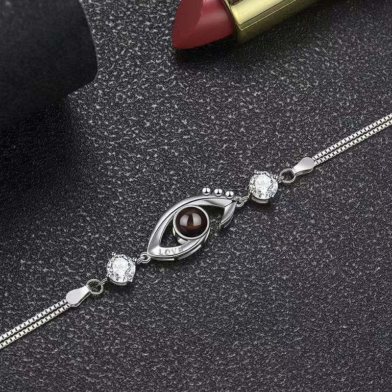 Pulsera de ojo de demonio con proyección de fotos 