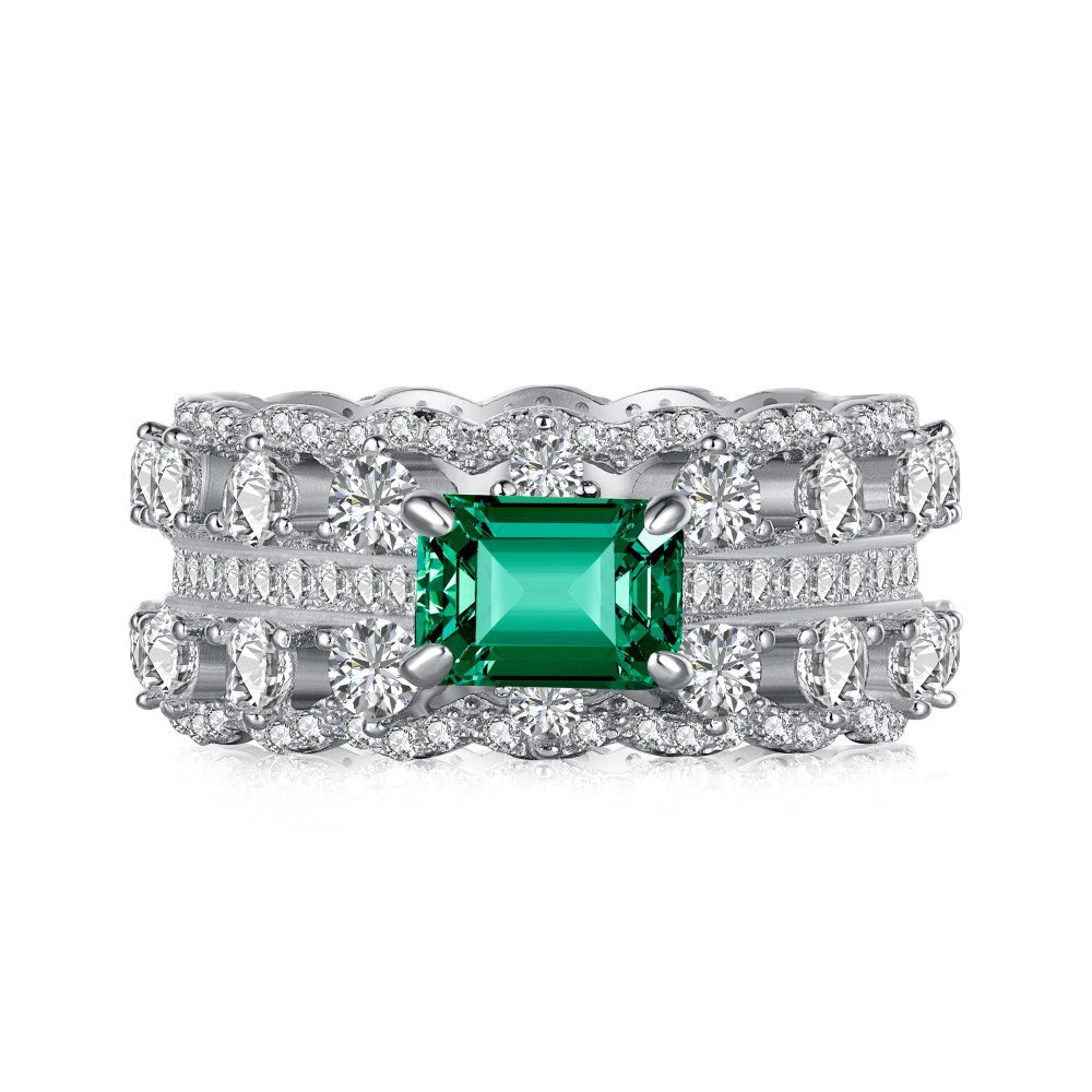 Anillo retro de esmeralda con circonita de alta gama