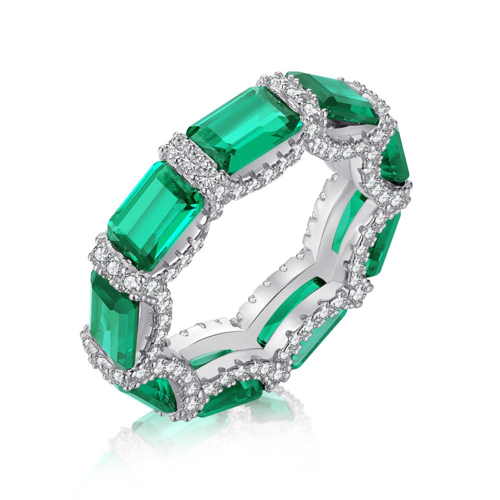 Anillo retro de esmeralda con circonita de alta gama