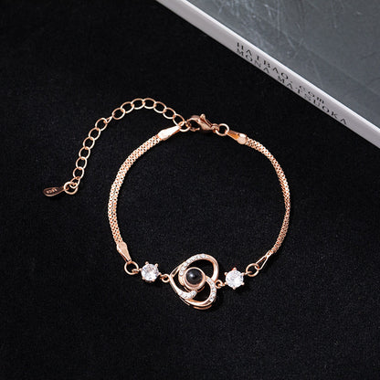 Pulsera con proyección de fotos de circonitas en forma de corazón 