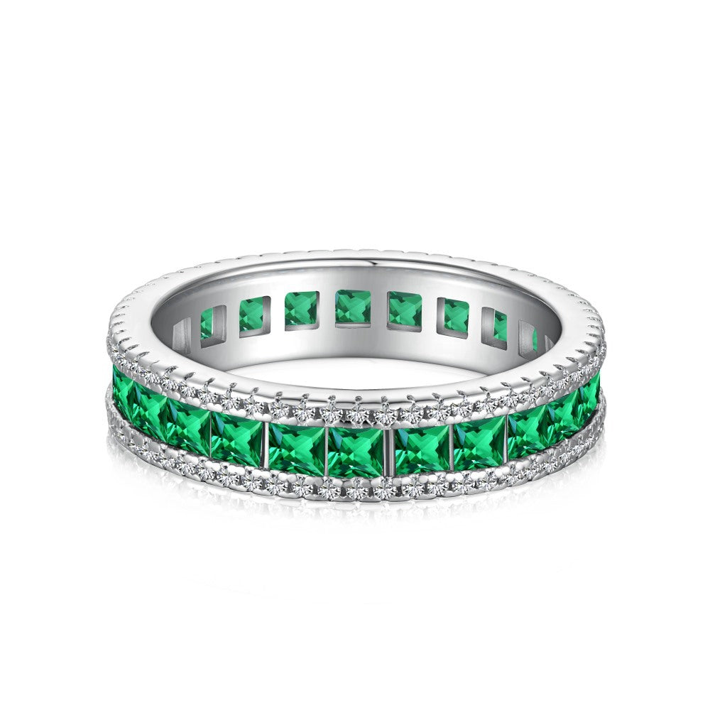 Anillo retro de esmeralda con circonita de alta gama