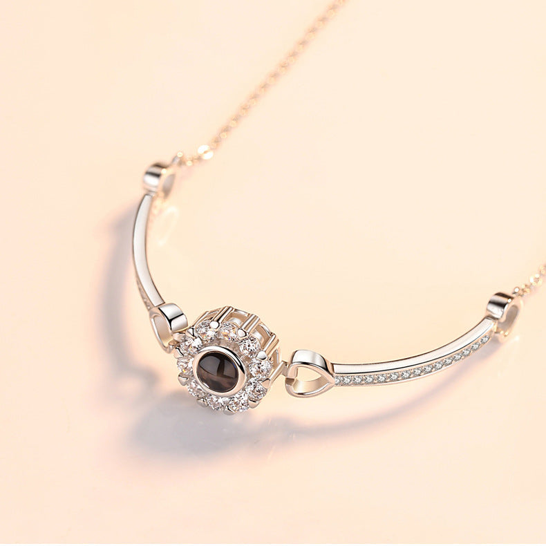 Pulsera de girasol con circonitas y proyección de fotos 