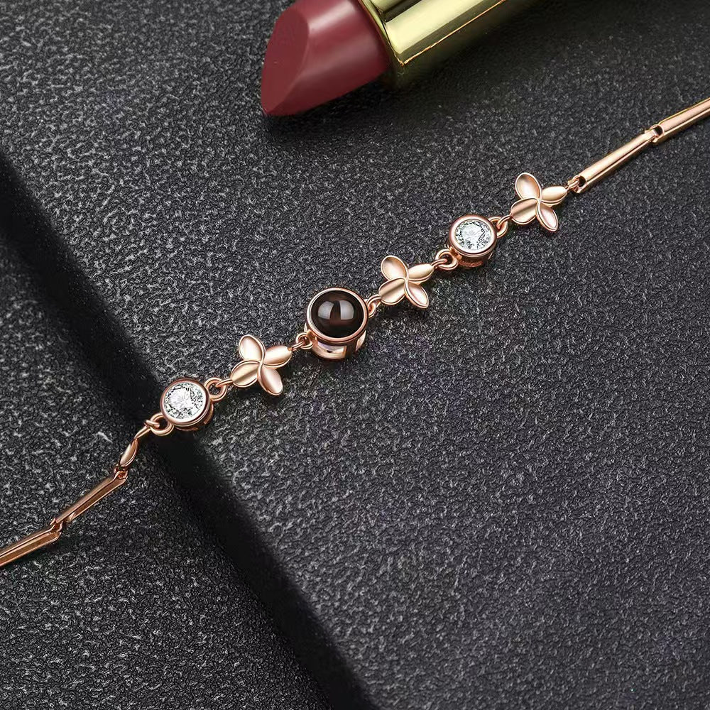 Pulsera de trébol de cuatro hojas con proyección de fotos 