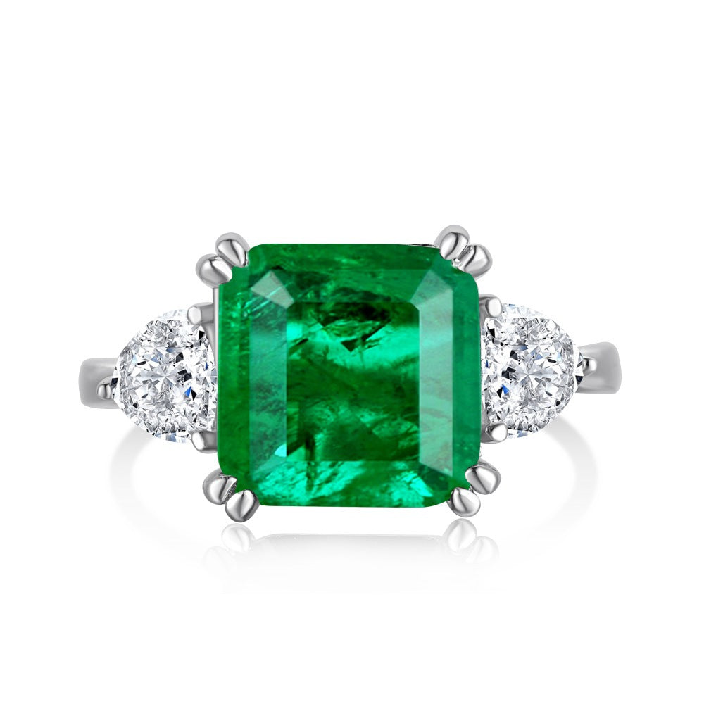 Anillo retro de esmeralda con circonita de alta gama