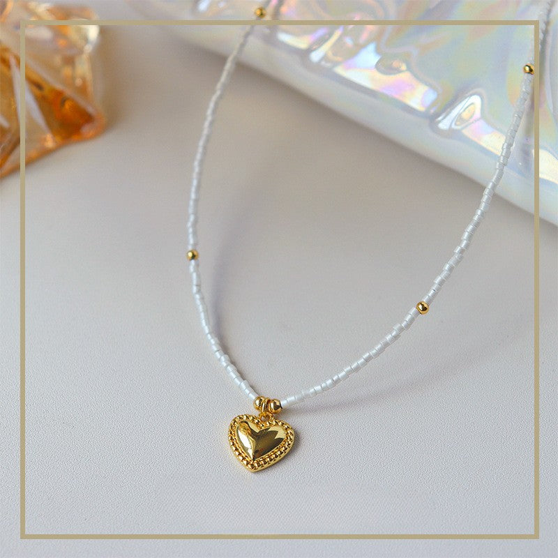 Collar de corazón con cuentas de mijo simple de alta gama para mujer 
