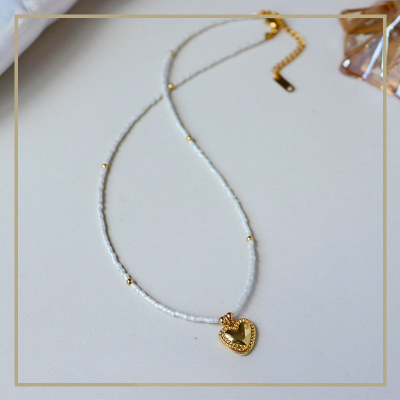 Collar de corazón con cuentas de mijo simple de alta gama para mujer 