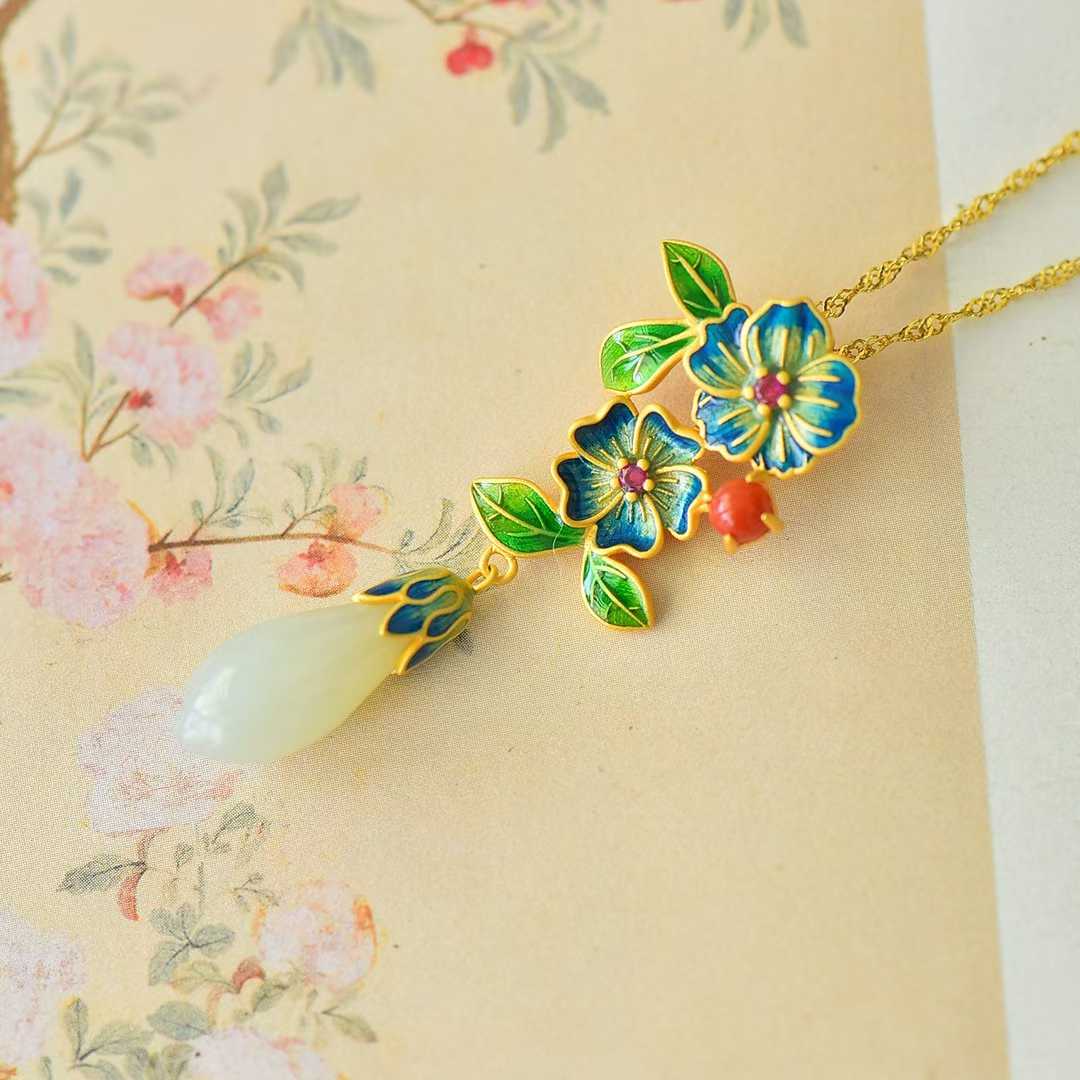 Close-up of magnolia and Ruyi carving on Hetian jade pendant
